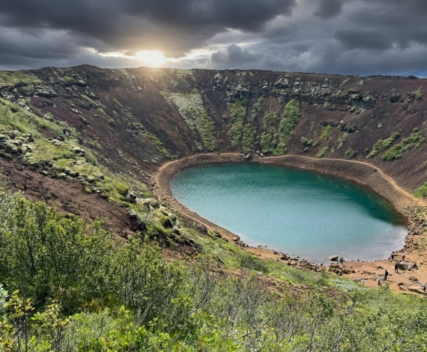 Vivid red volcanic crater lake Kerid with aquamarine water on the Golden Circle in South Iceland