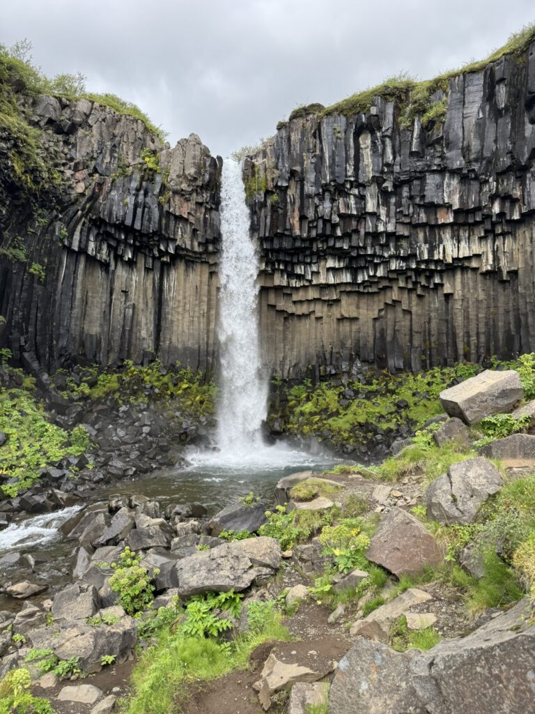 Svartifoss waterfall in Skaftafell surrounded by dramatic black hexagonal basalt columns