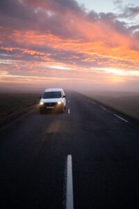 Iceland campervan driving on Ring Road with epic landscape in background