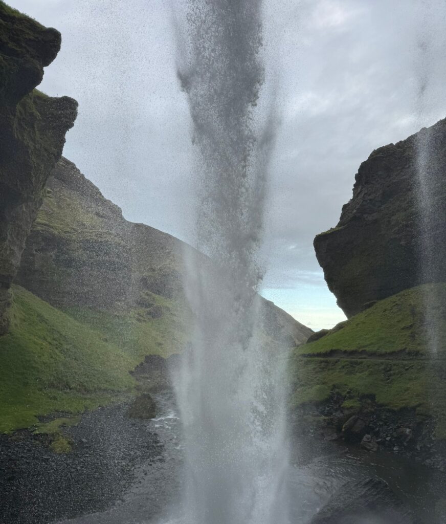 View from behind Kvernufoss hidden waterfall near Skogafoss on day 10 of the Iceland Ring Road itinerary