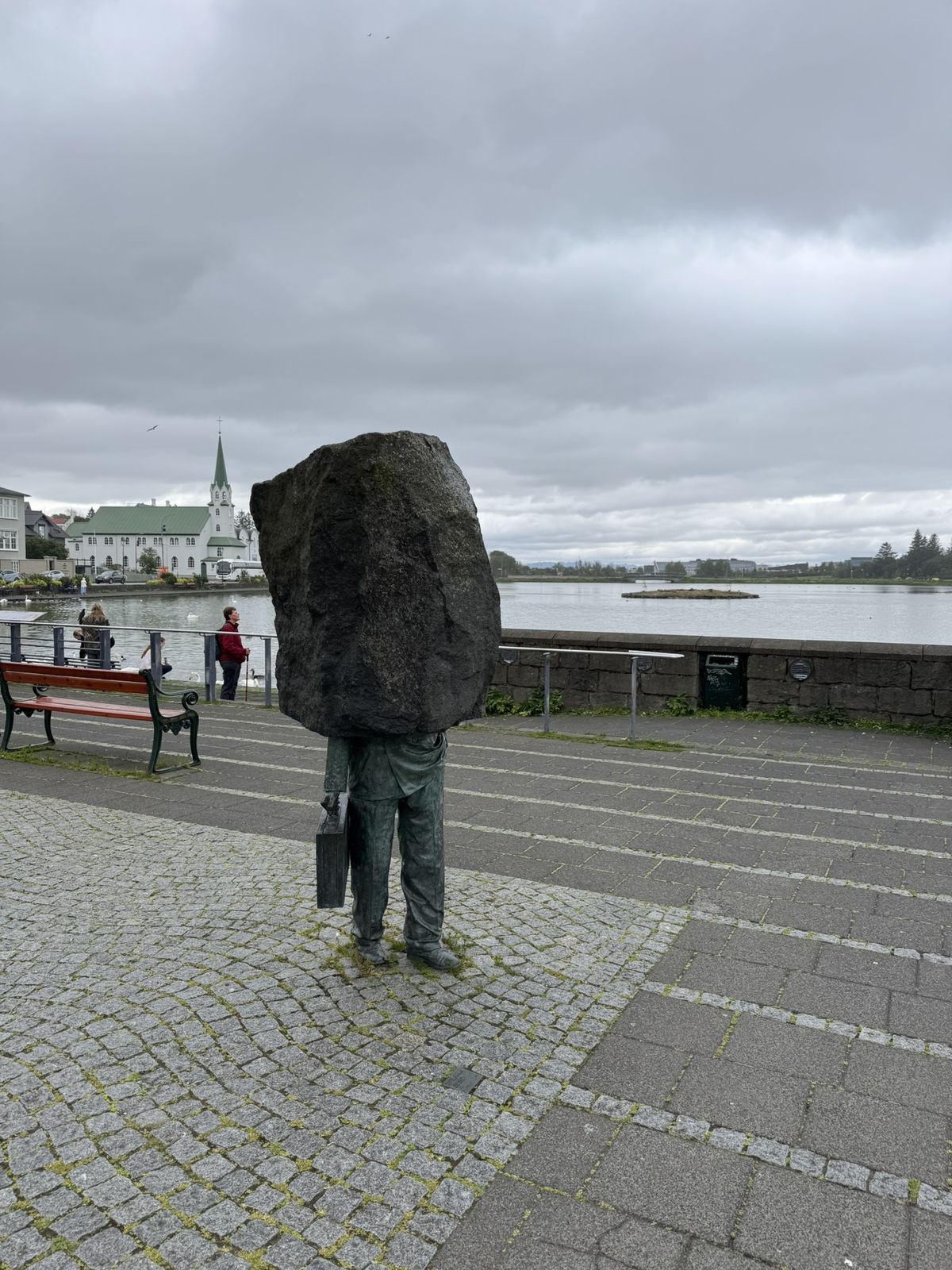 The Monument to the Unknown Bureaucrat by Magnus Tomasson beside Tjornin lake in central Reykjavik