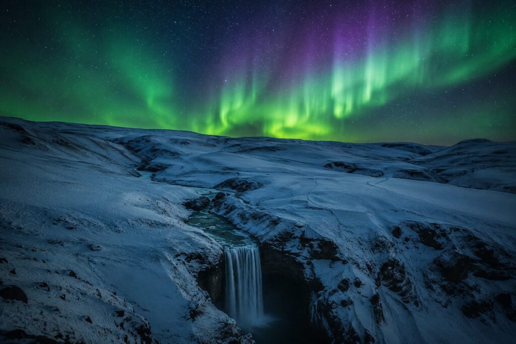 Illustration of the northern lights over Skógafoss waterfall in winter