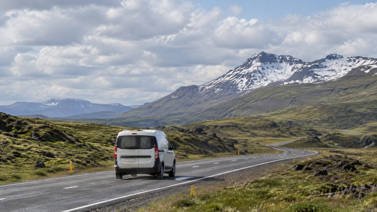 Campervan driving along Iceland’s Ring Road in summer